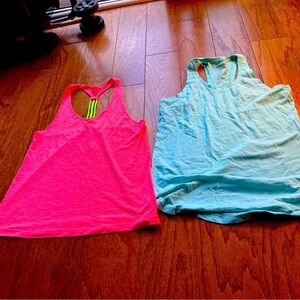 Two athletic tank shirts Tel Gear
